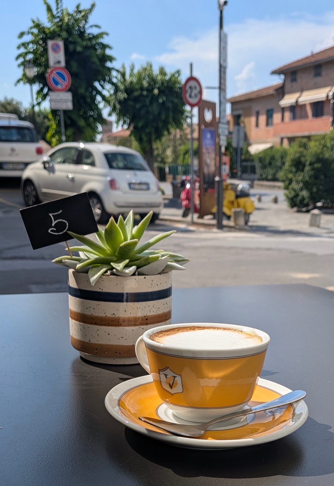 Cappuccino on an outdoor table at a café in Pienza, Val d'Orcia